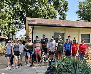 people in front of a house
